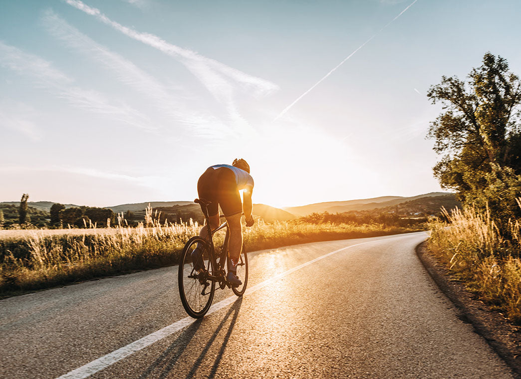 Road Cyclist Training At Golden Hour With Steady Energy And Endurance Fuel