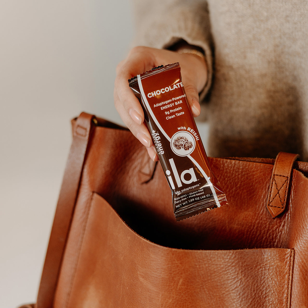 ILA Adaptogen Chocolate Bars Ila Energy on the go.  Image Of Energy Bar Going In A Purse 